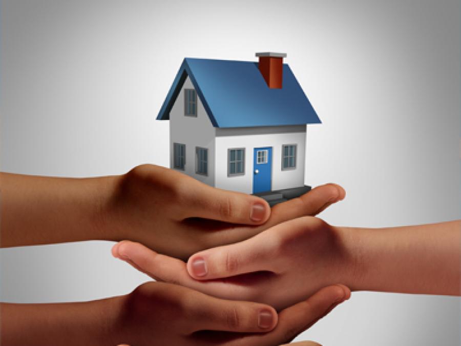 hands holding a house